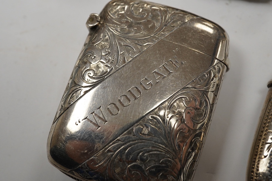 Five assorted late 19th/early 20th century silver vesta cases, including a George V circular case by William Neale Ltd, 45mm and a late Victorian arched by George Unite. Condition - fair